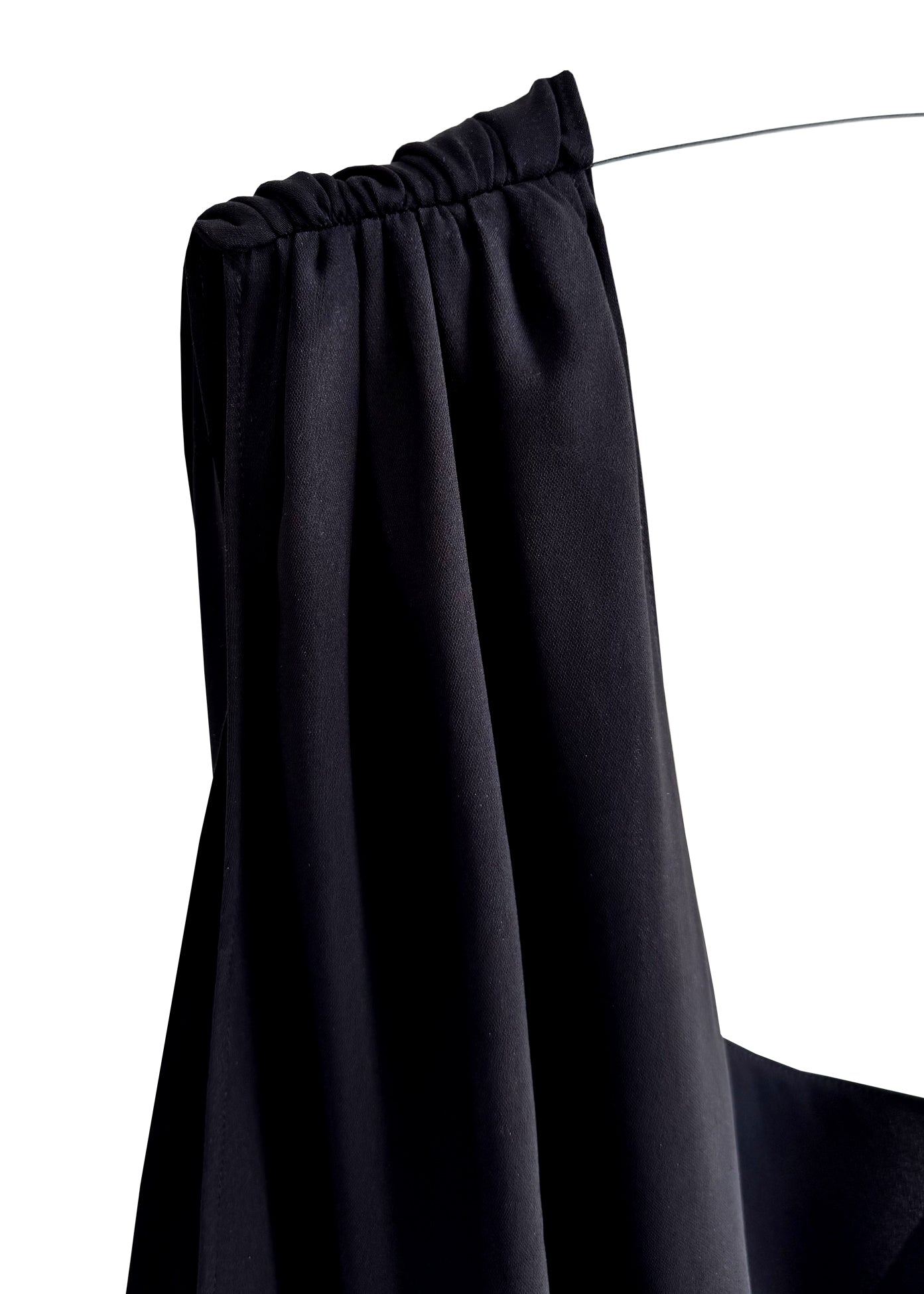 Black one-shoulder dress on a white background