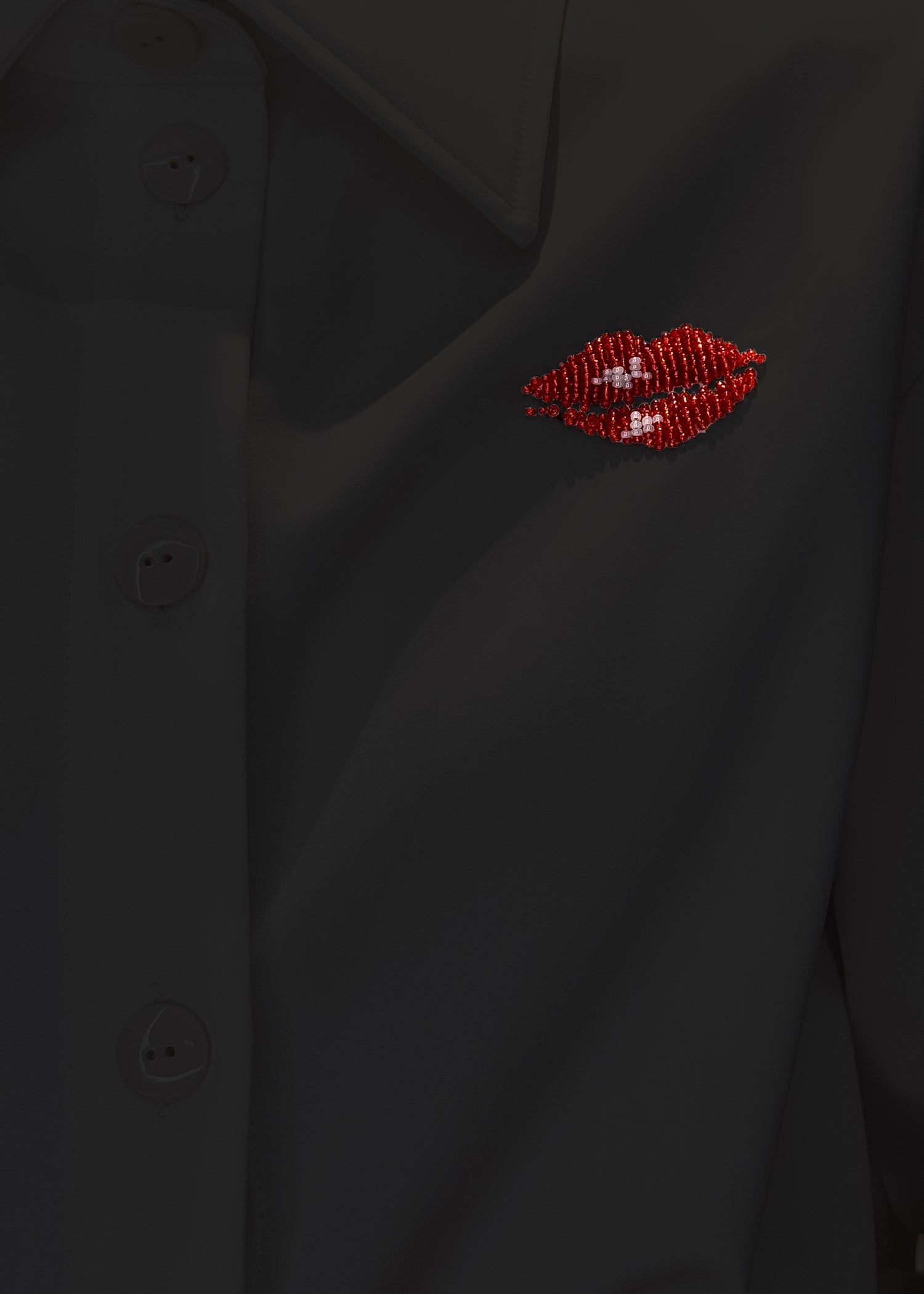 embroidered lips on black oversize shirt as optional detail