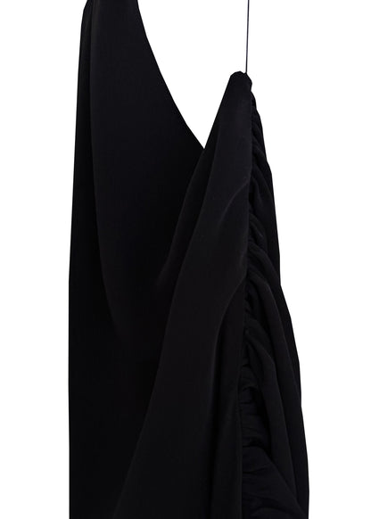 Black dress on a mannequin against a white background